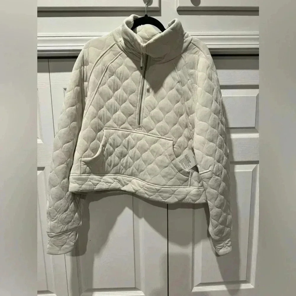 Lululemon scuba half zip xl xxl  between a beige and light grey.